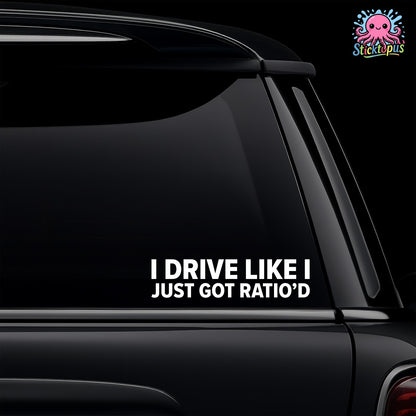 Car window with a humorous decal reading 'I drive like I just got ratio'd' on a black background.