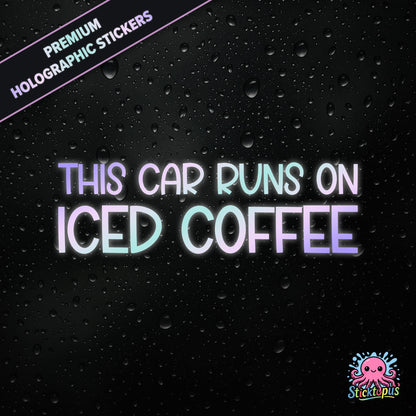 Premium holographic sticker with the phrase “THIS CAR RUNS ON ICED COFFEE” in bold, colour-shifting text on a black background with water droplets.