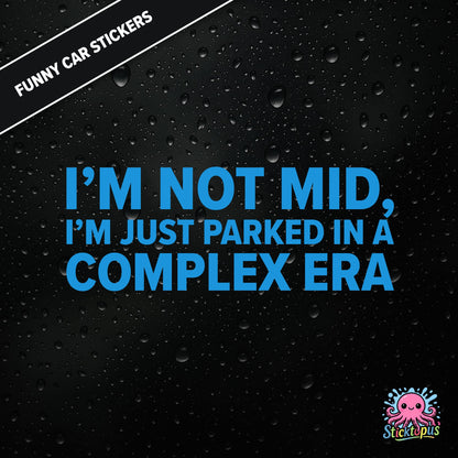 I’m Not Mid, I’m Just Parked In A Complex Era — absurd mid-era sticker in blue text, surreal generational nonsense.