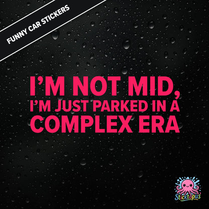 I’m Not Mid, I’m Just Parked In A Complex Era — absurd mid-era sticker in pink text, surreal generational nonsense.