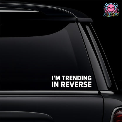 Black car with 'I'm Trending in Reverse' decal and Sticktopus logo.