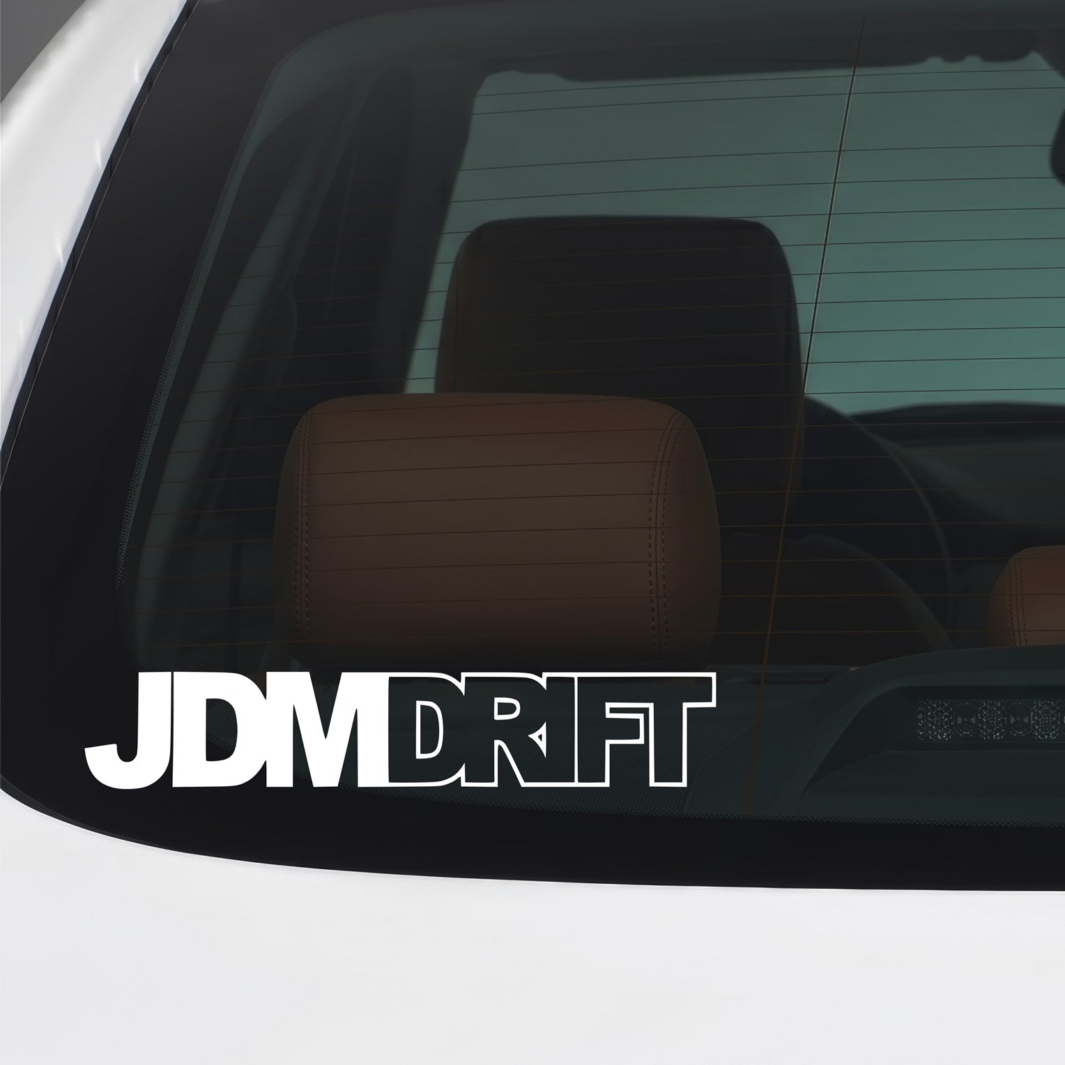White JDM Drift bold outline vinyl sticker applied to a car window.