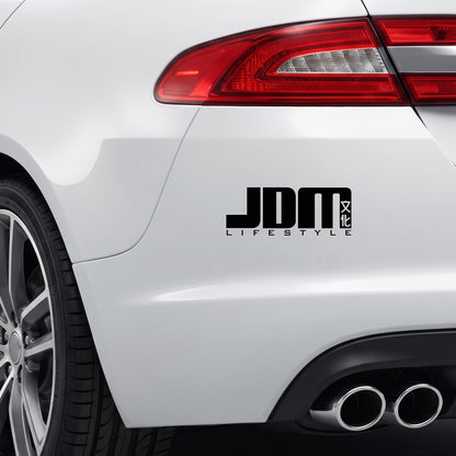 Black JDM Lifestyle vinyl sticker applied to a car bumper.