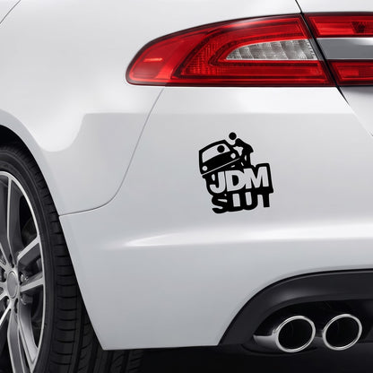 Black JDM Slut vinyl sticker applied to a car rear bumper.