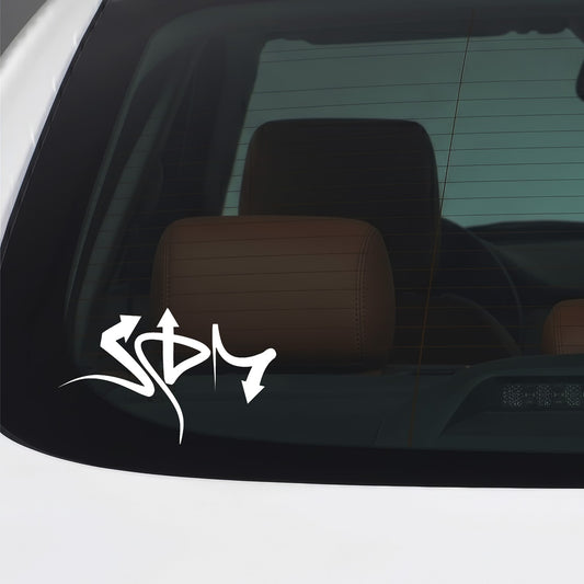 White JDM graffiti script sticker applied to a car window.