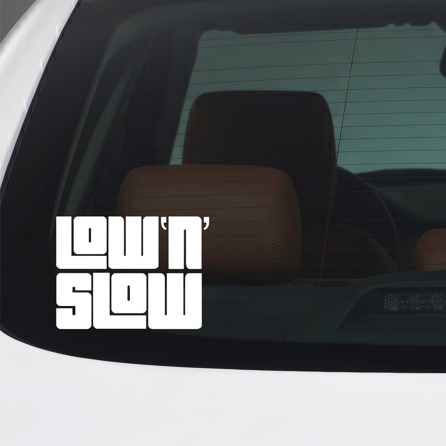 White Low N Slow vinyl sticker applied to a car window.