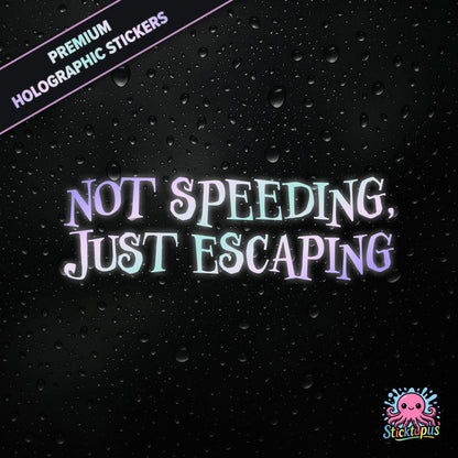 Premium holographic sticker with the phrase “NOT SPEEDING, JUST ESCAPING” in bold, pastel-shifting text on a black background with water droplets.