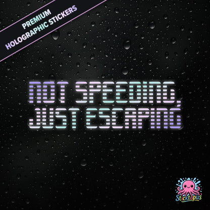 Premium holographic sticker with the phrase “NOT SPEEDING, JUST ESCAPING” in bold, pastel-shifting text on a black background with water droplets.