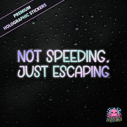 Premium holographic sticker with the phrase “NOT SPEEDING, JUST ESCAPING” in bold, pastel-shifting text on a black background with water droplets.