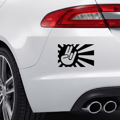 Black Peace Japan Rising Sun sticker applied to a car rear bumper.
