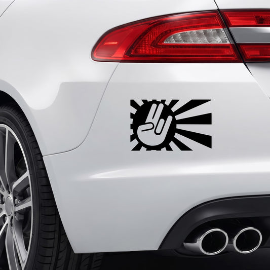 Black Peace Japan Rising Sun sticker applied to a car rear bumper.