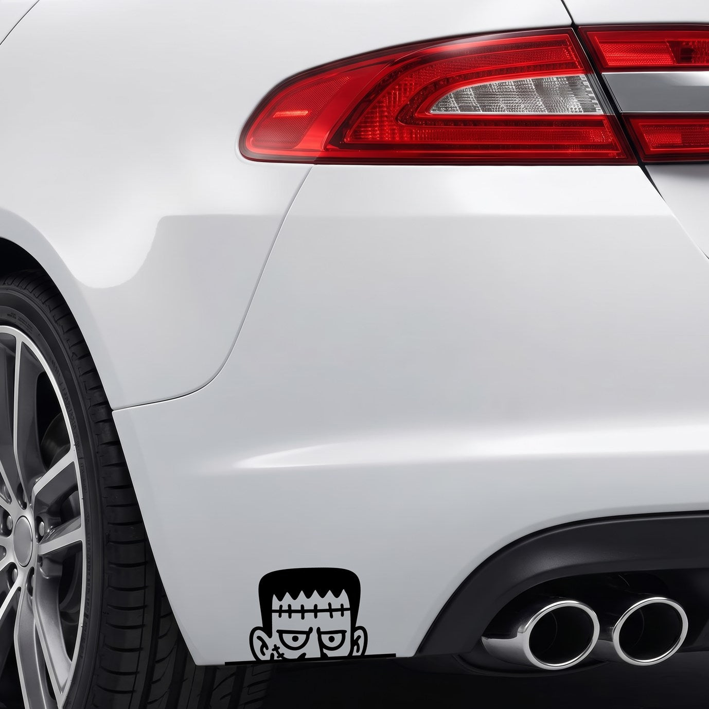 Black Peeking Frankenstein vinyl sticker applied to a car rear bumper.