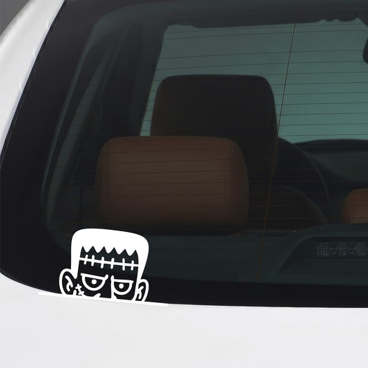 White peeking Frankenstein vinyl sticker applied to a car window.