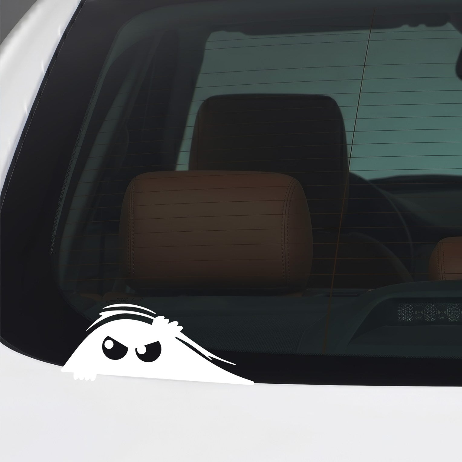 White peeking monster sticker applied to a car window.