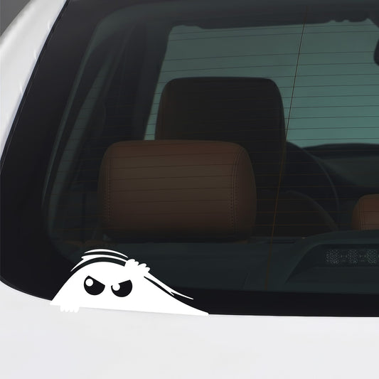 White peeking monster sticker applied to a car window.