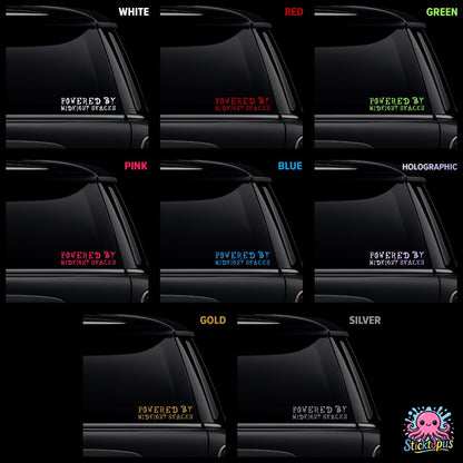 Collection of car window decals with 'Powered by Midnight Snacks' text in various colors on a black background.