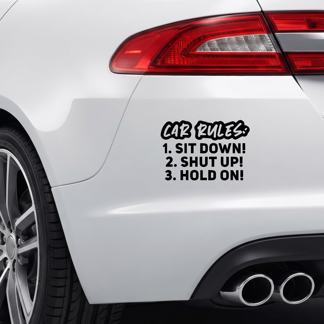 Black Sit Down! Shut Up! Hold On! vinyl sticker applied to a car bumper.
