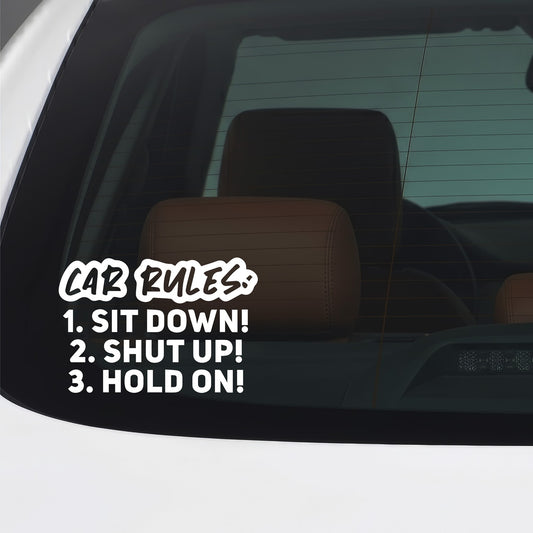 White Sit Down Shut Up Hold On sticker applied to a car window.