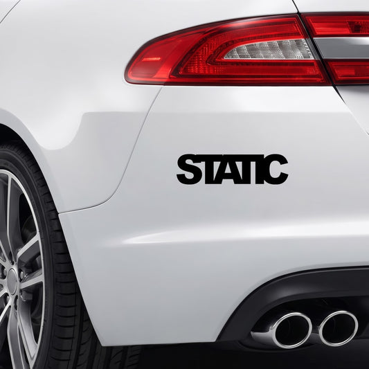 Black STATIC vinyl sticker applied to a car rear bumper.