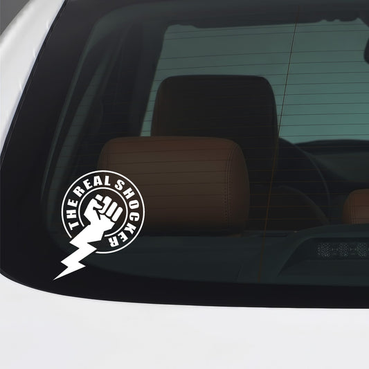 White The Real Shocker vinyl sticker applied to a car window.