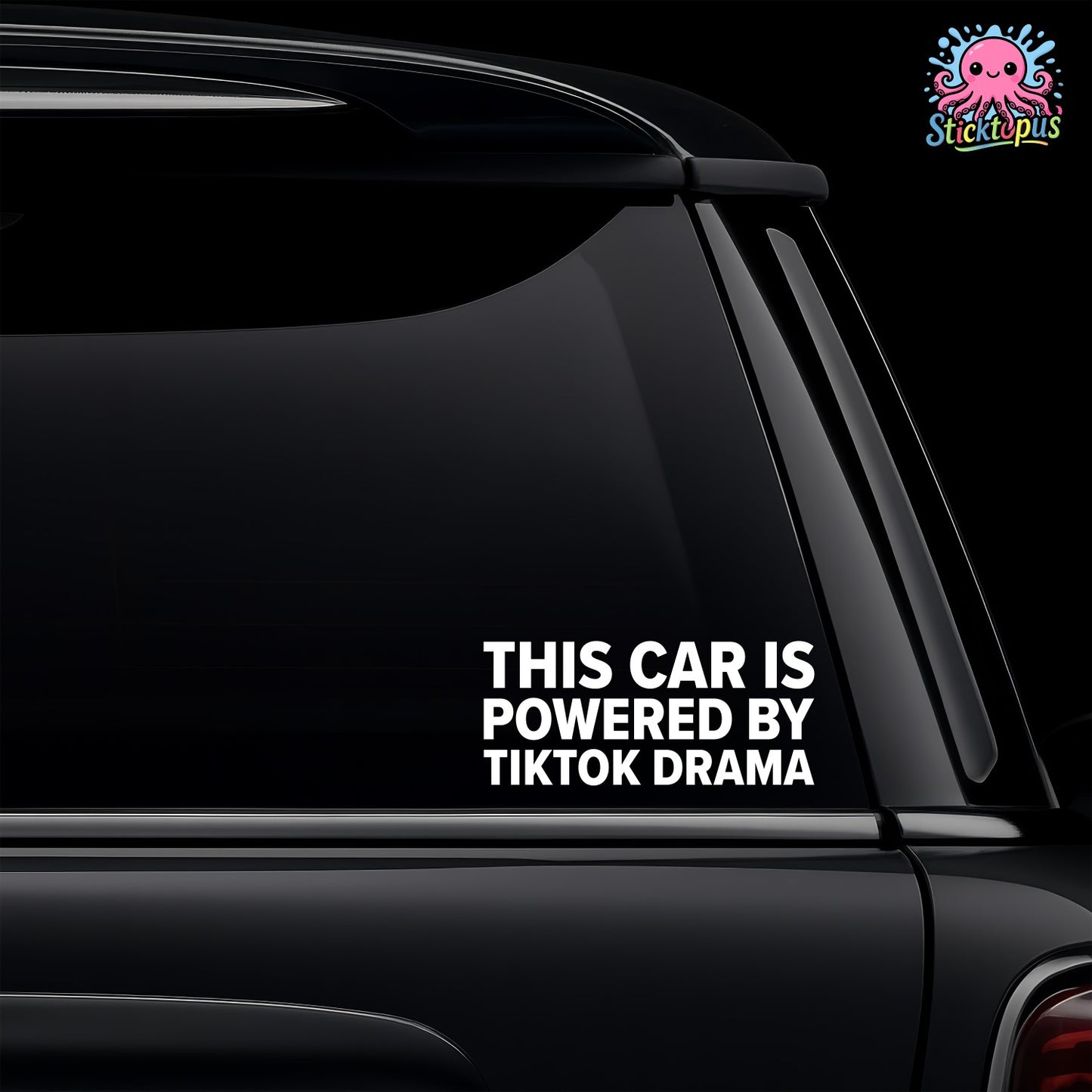 Car window with a decal saying 'This car is powered by TikTok drama' on a black background.