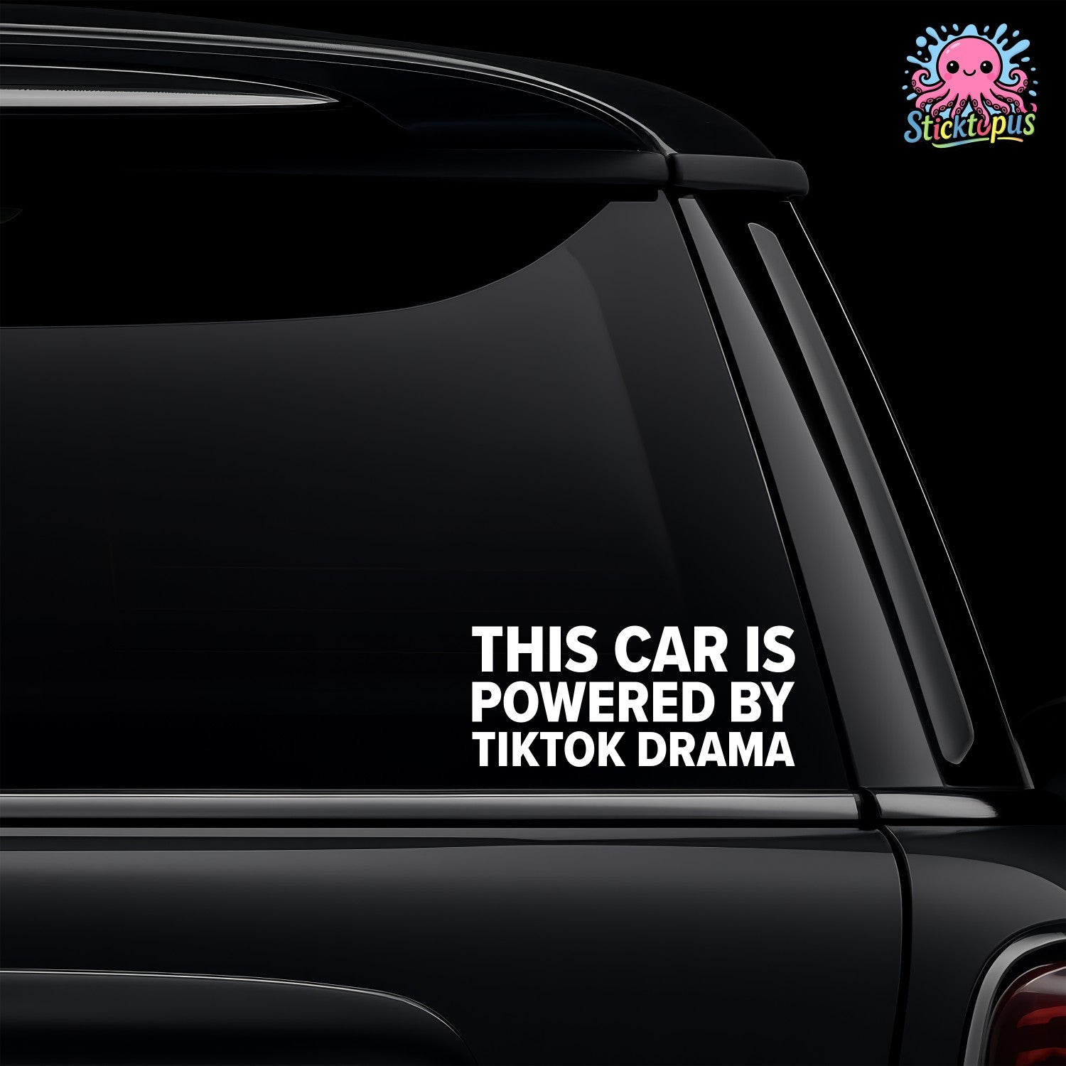 Car window with a decal saying 'This car is powered by TikTok drama' on a black background.