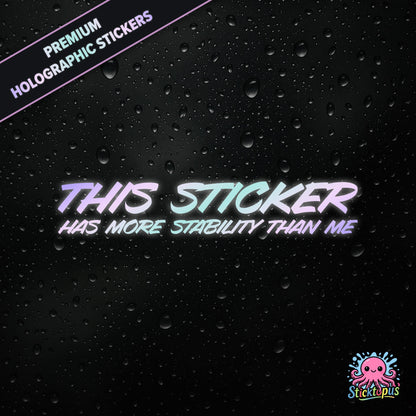 Premium holographic sticker with the phrase “THIS STICKER HAS MORE STABILITY THAN ME” in bold, pastel-shifting text on a black background with water droplets.