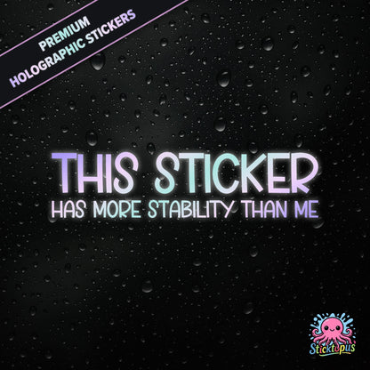 Premium holographic sticker with the phrase “THIS STICKER HAS MORE STABILITY THAN ME” in bold, pastel-shifting text on a black background with water droplets.
